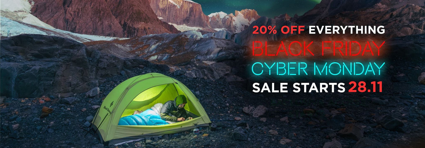 Camping tent under a mountainous landscape with promotional text for a sale. I zenbivy.eu