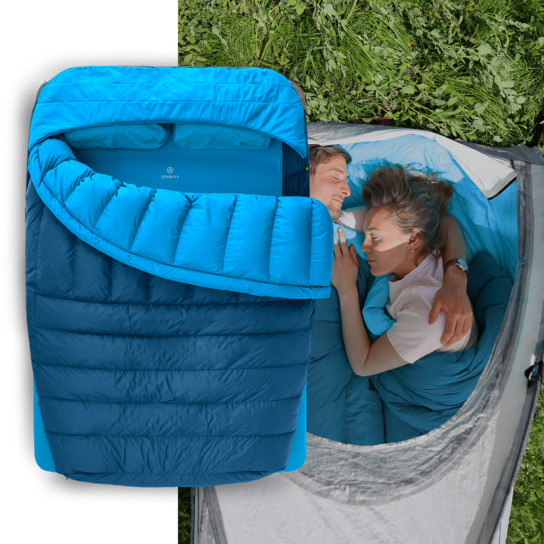 Blue sleeping bag with a person inside, surrounded by greenery